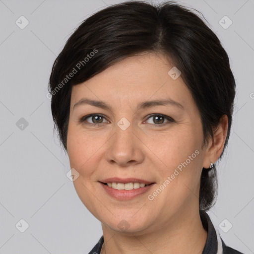 Joyful white adult female with medium  brown hair and brown eyes