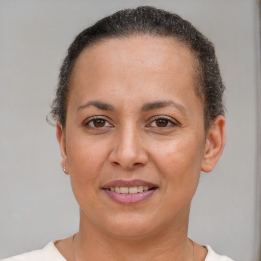 Joyful white adult female with short  brown hair and brown eyes