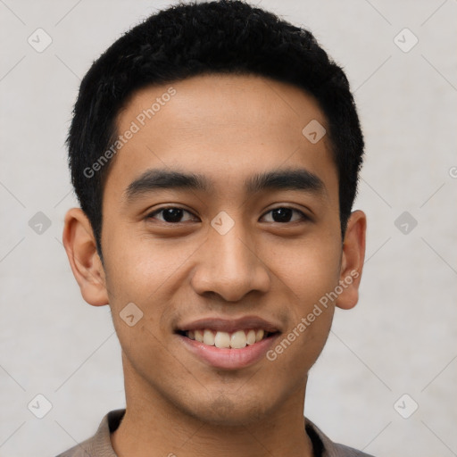 Joyful latino young-adult male with short  black hair and brown eyes