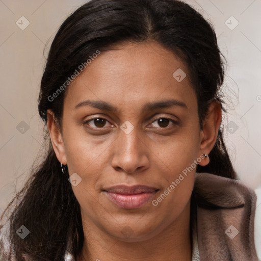 Joyful latino young-adult female with long  brown hair and brown eyes