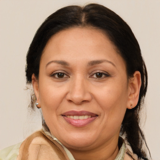 Joyful white adult female with medium  brown hair and brown eyes
