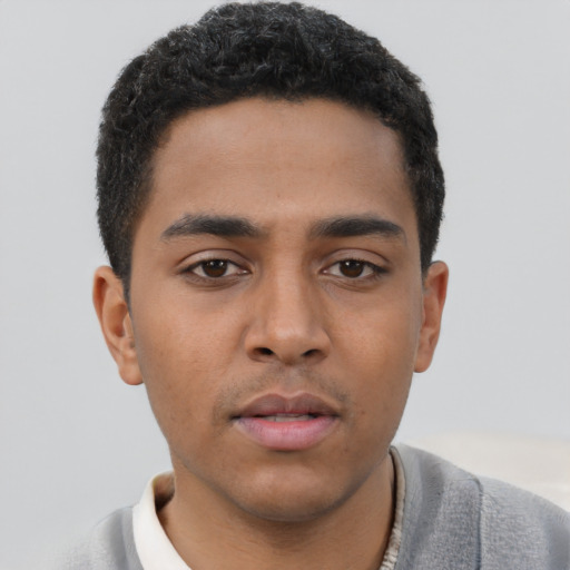 Neutral latino young-adult male with short  black hair and brown eyes