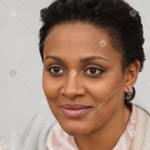 Joyful black young-adult female with short  brown hair and brown eyes