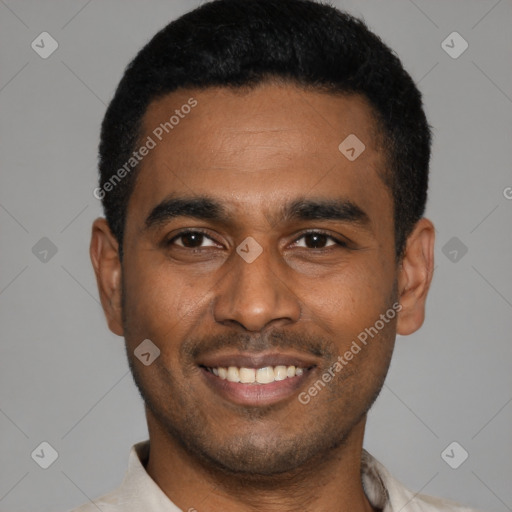 Joyful latino young-adult male with short  black hair and brown eyes