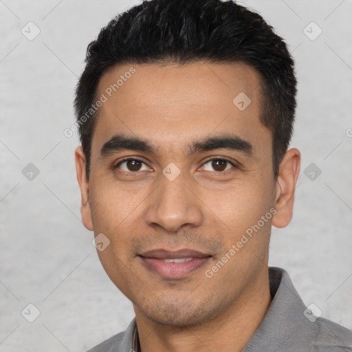Joyful white young-adult male with short  black hair and brown eyes
