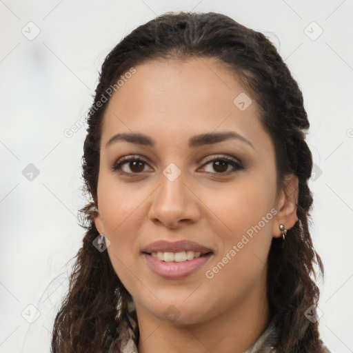 Joyful latino young-adult female with long  brown hair and brown eyes