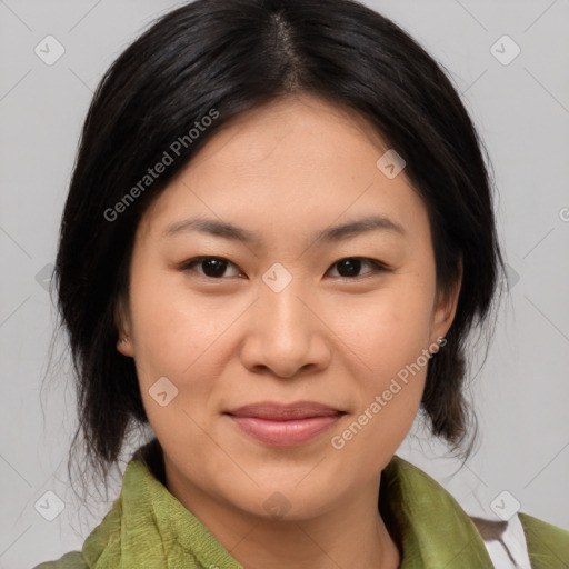 Joyful asian young-adult female with medium  brown hair and brown eyes