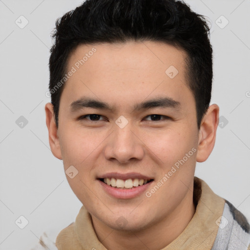 Joyful asian young-adult male with short  brown hair and brown eyes