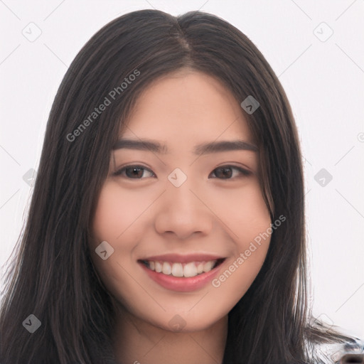 Joyful asian young-adult female with long  brown hair and brown eyes