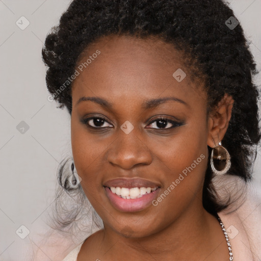 Joyful black young-adult female with long  brown hair and brown eyes