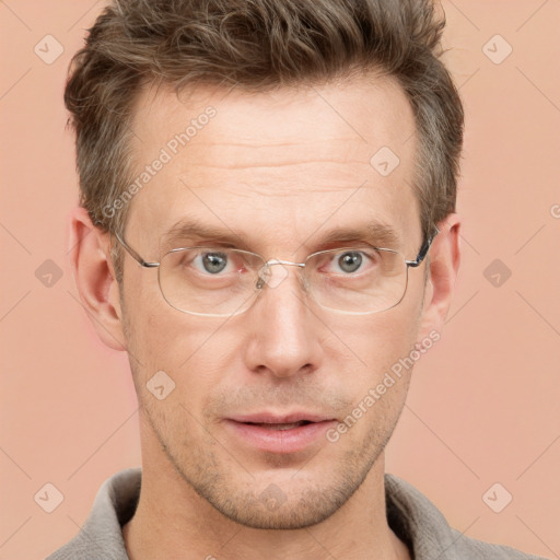 Joyful white adult male with short  brown hair and grey eyes