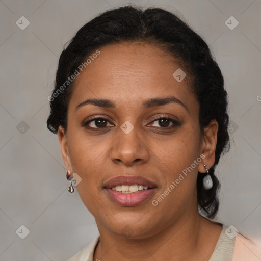 Joyful latino adult female with medium  brown hair and brown eyes