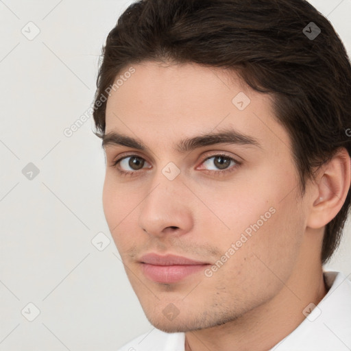 Neutral white young-adult male with short  brown hair and brown eyes