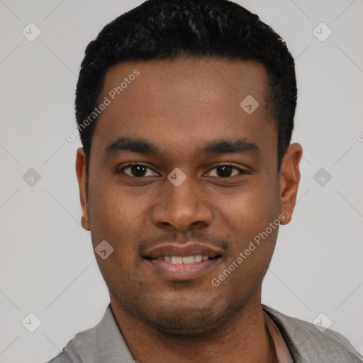 Joyful black young-adult male with short  black hair and brown eyes