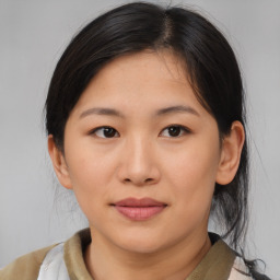 Joyful asian young-adult female with medium  brown hair and brown eyes