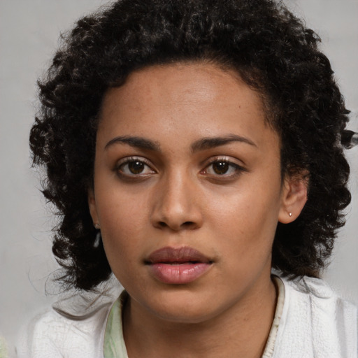 Neutral latino young-adult female with medium  brown hair and brown eyes