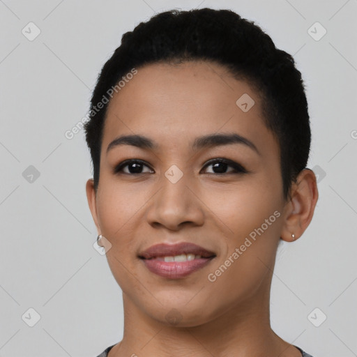 Joyful latino young-adult female with short  black hair and brown eyes