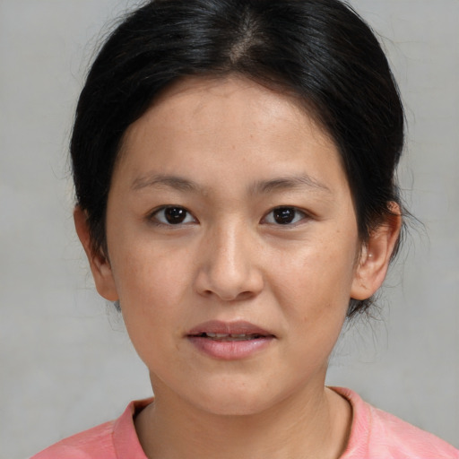 Joyful white young-adult female with medium  brown hair and brown eyes