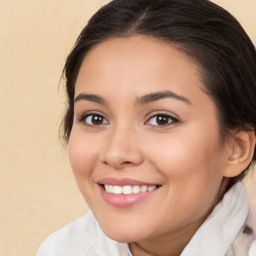 Joyful white young-adult female with medium  brown hair and brown eyes