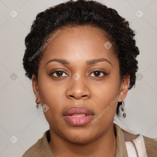 Joyful black young-adult female with short  brown hair and brown eyes