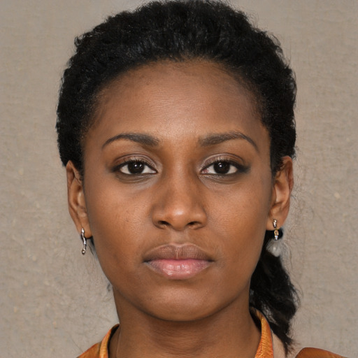 Neutral black young-adult female with medium  black hair and brown eyes