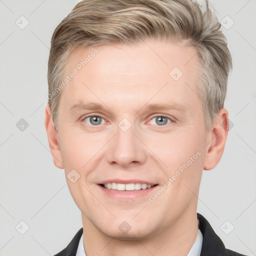 Joyful white adult male with short  brown hair and grey eyes