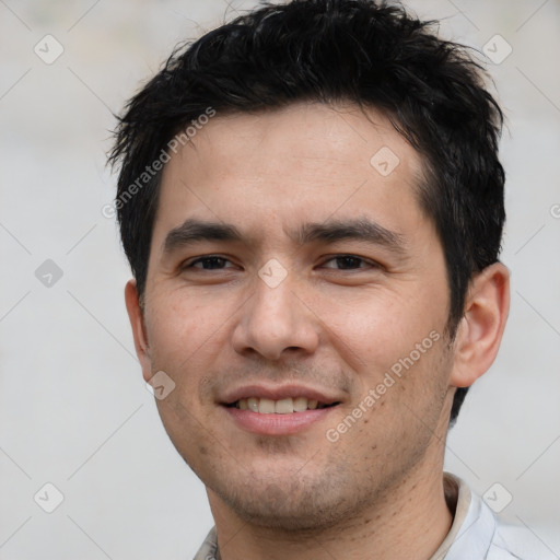 Joyful white young-adult male with short  black hair and brown eyes