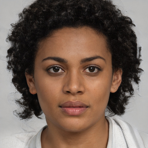Neutral black young-adult female with medium  black hair and brown eyes