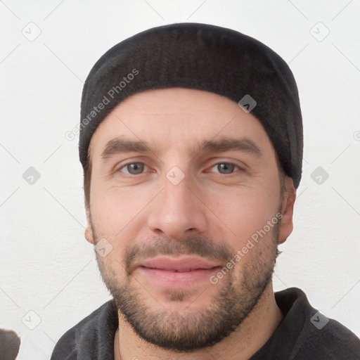 Joyful white young-adult male with short  black hair and brown eyes