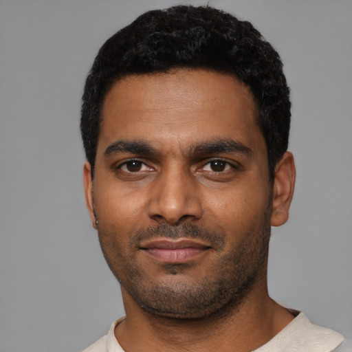 Neutral black young-adult male with short  black hair and brown eyes