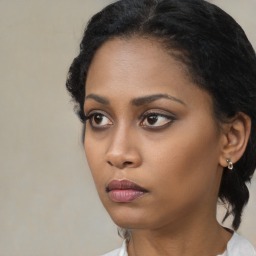 Neutral black young-adult female with short  black hair and brown eyes