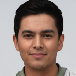 Joyful asian young-adult male with short  black hair and brown eyes