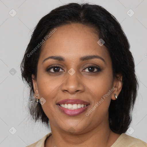 Joyful black young-adult female with medium  brown hair and brown eyes