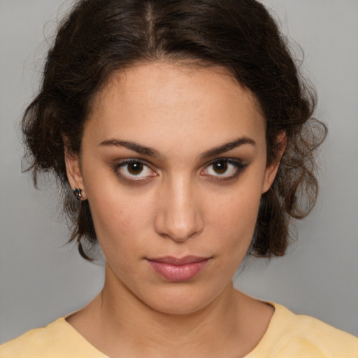 Neutral white young-adult female with medium  brown hair and brown eyes