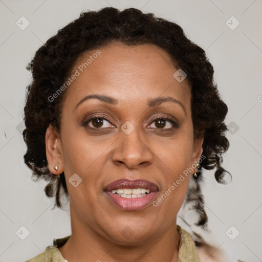 Joyful black adult female with medium  brown hair and brown eyes