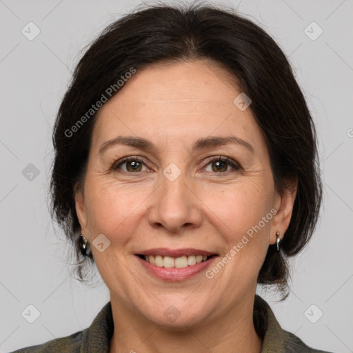 Joyful white adult female with medium  brown hair and brown eyes