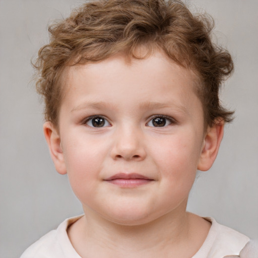 Joyful white child male with short  brown hair and brown eyes