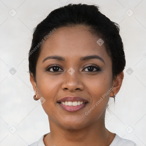 Joyful latino young-adult female with short  black hair and brown eyes