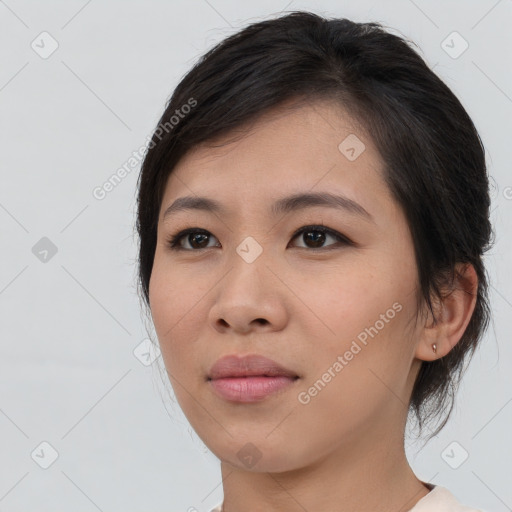 Joyful asian young-adult female with medium  black hair and brown eyes