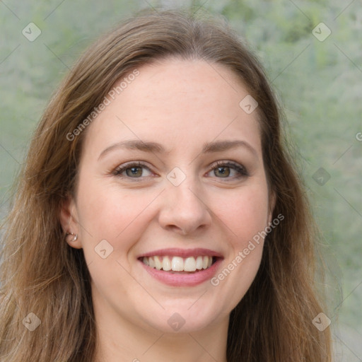 Joyful white young-adult female with long  brown hair and green eyes