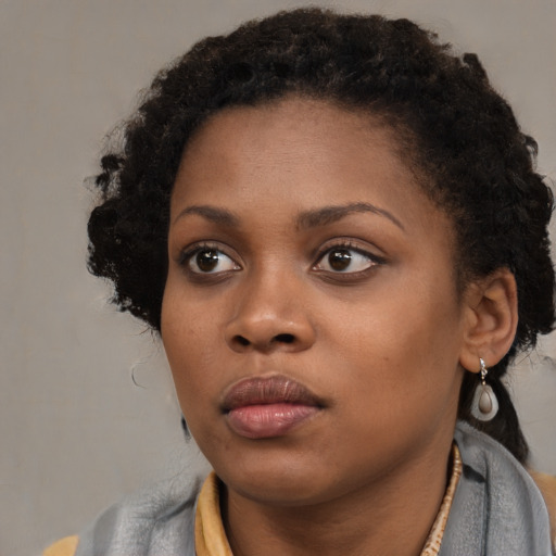 Neutral black young-adult female with short  brown hair and brown eyes