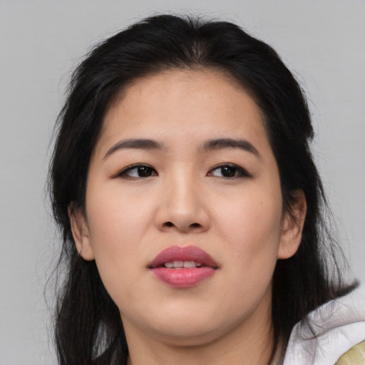 Joyful asian young-adult female with medium  brown hair and brown eyes