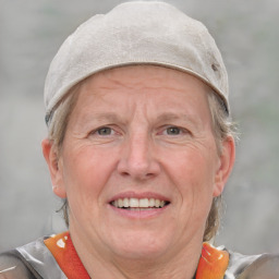 Joyful white middle-aged female with short  gray hair and grey eyes