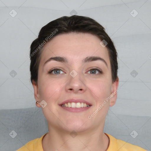 Joyful white young-adult female with short  brown hair and grey eyes