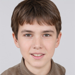 Joyful white child male with short  brown hair and brown eyes