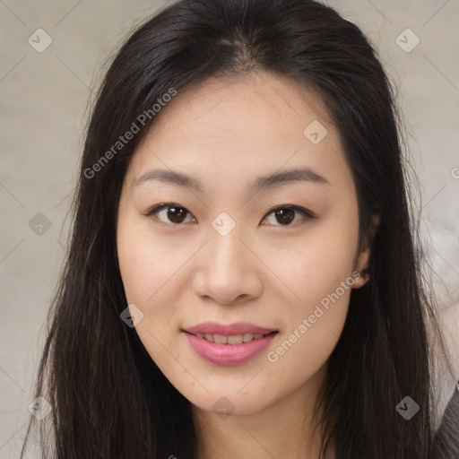 Joyful asian young-adult female with long  brown hair and brown eyes