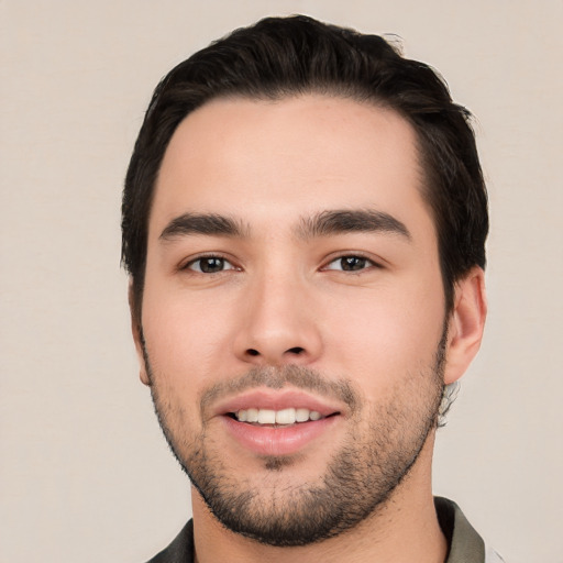 Joyful white young-adult male with short  black hair and brown eyes