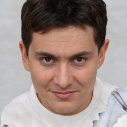 Joyful white adult male with short  brown hair and brown eyes