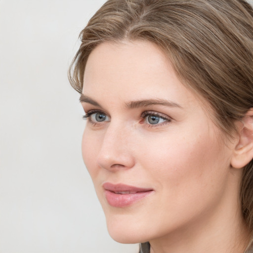 Neutral white young-adult female with medium  brown hair and grey eyes