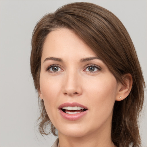 Joyful white young-adult female with medium  brown hair and brown eyes